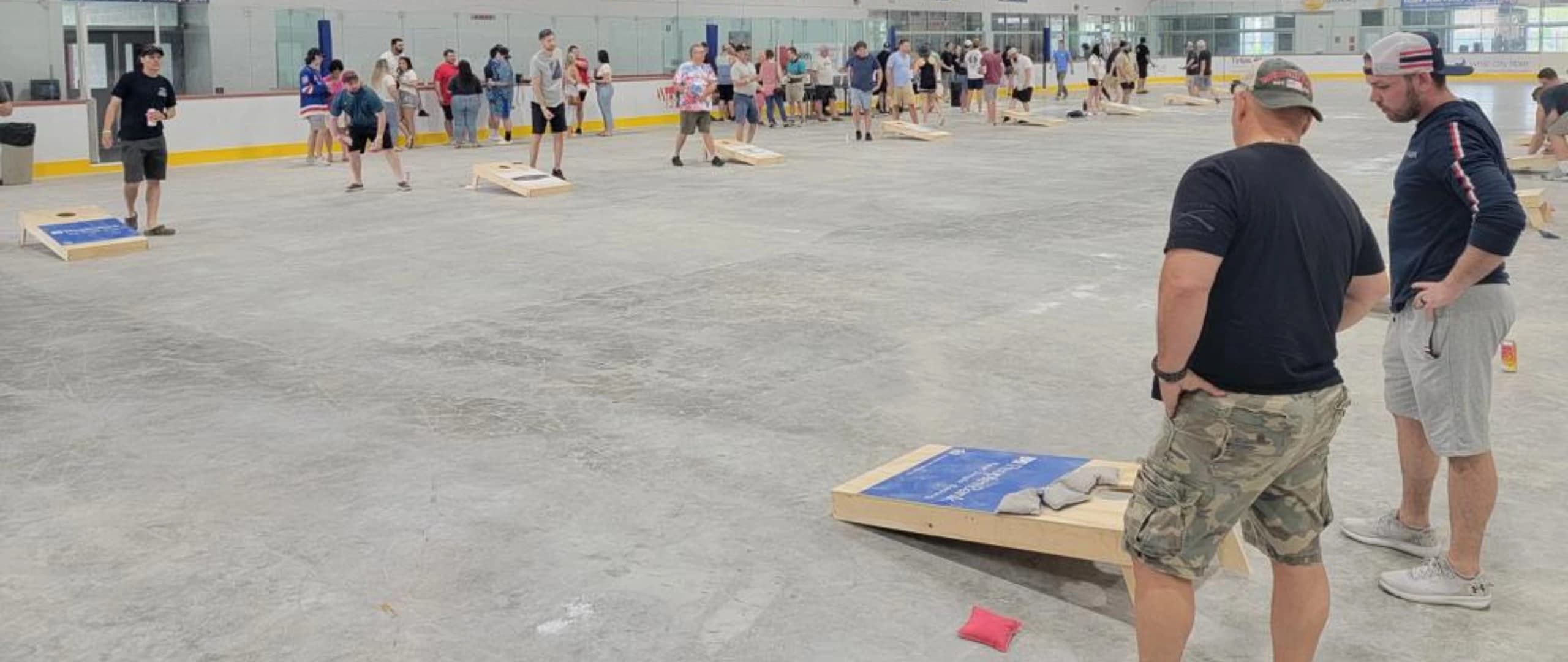 Cornhole players in action