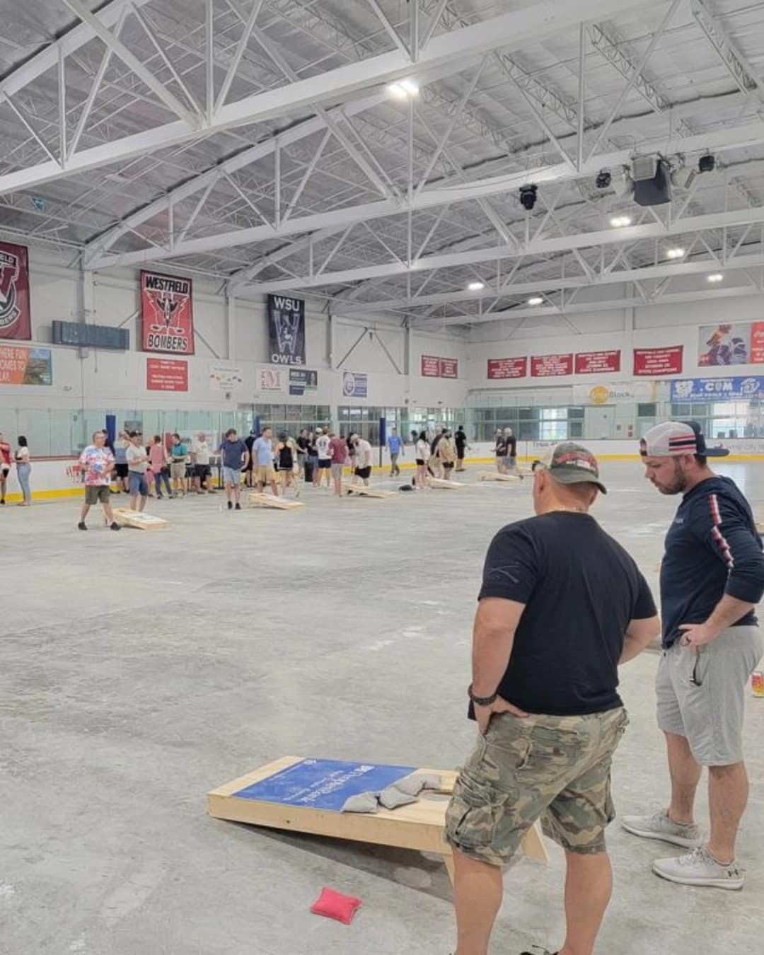Cornhole players in action