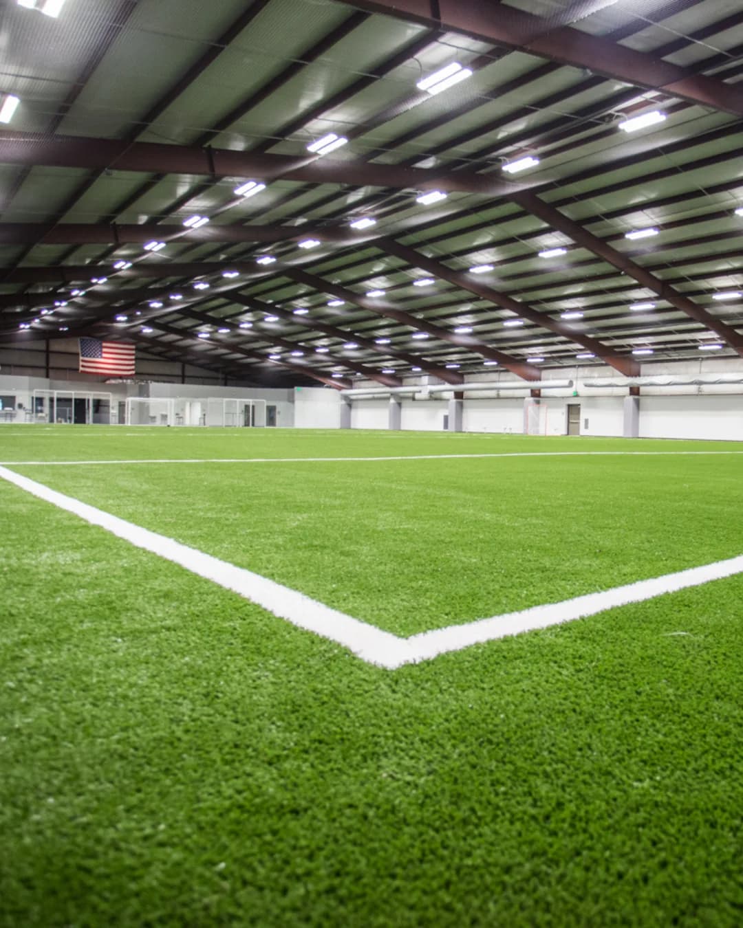 Indoor soccer players in action